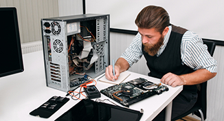 Image of A colleague fixing hardware